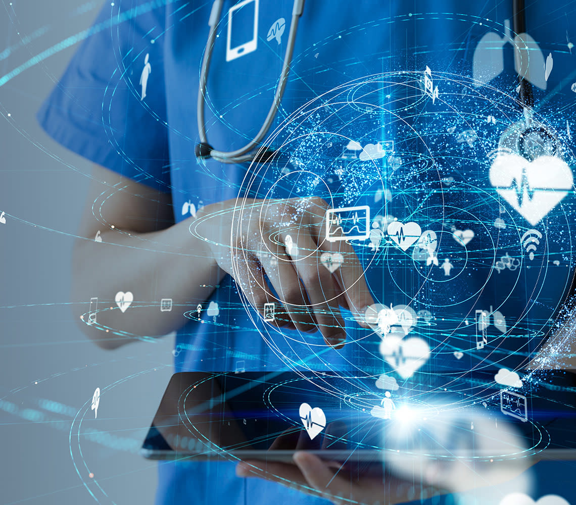 Image of a medical personnel holding a tablet with medical graphics signify merging three medical systems into one.